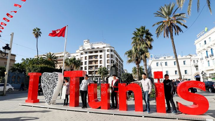Tourists pose for a picture in downtown Tunis, Tunisia, January 18, 2018. Picture taken January 18, 2018. REUTERS/Zoubeir Souissi
