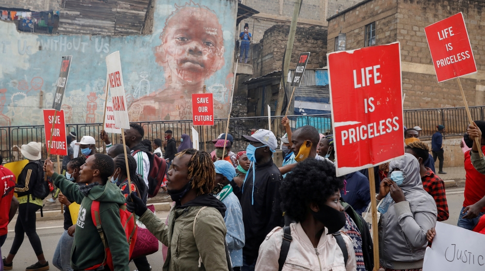 Protesters hold placards during a demonstration against police killings and brutality, in the Mathare slum in Nairobi, Kenya, June 8, 2020. REUTERS/Baz Ratner TPX IMAGES OF THE DAY
