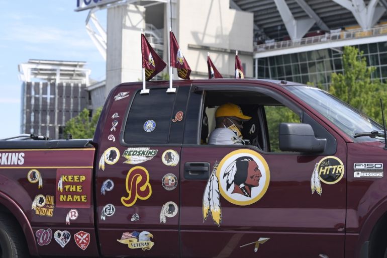 Rodney Johnson of Chesapeake, Va., sits in his truck outside FedEx Field in Landover, Md., Monday, July 13, 2020. The Washington NFL franchise announced Monday that it will drop the "Redskins" name an