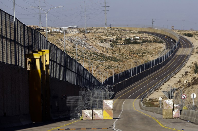 A newly opened segregated West Bank highway is seen near Jerusalem Thursday, Jen. 10, 2019. Israel has opened a controversial new West Bank highway on Thursday that features a large concrete wall segr