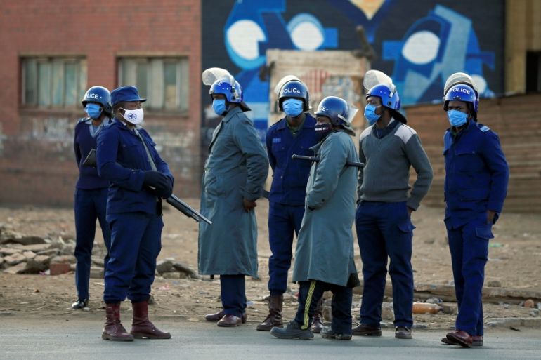 Police patrol the streets ahead of planned anti-government protests in Harare
