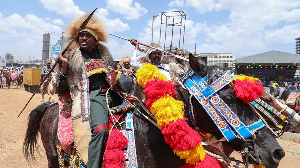 Ethiopian Oromo musician, Haacaaluu Hundeessaa, rides a horse in traditional costume during the 123rd anniversary celebration of the battle of Adwa where the Ethiopian forces defeated the invading Ita