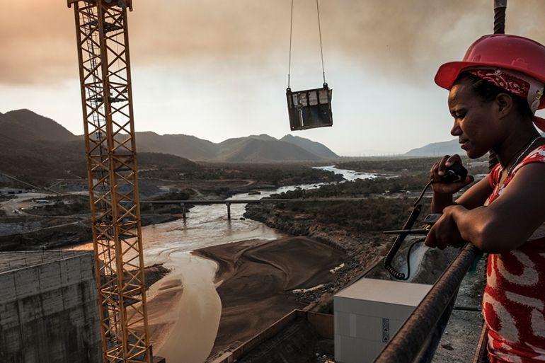 (FILES) In this file photo taken on December 26, 2019 Workey Tadele, a radio operator, at the Grand Ethiopian Renaissance Dam (GERD), near Guba in Ethiopia. - African leaders are expected to hold a su