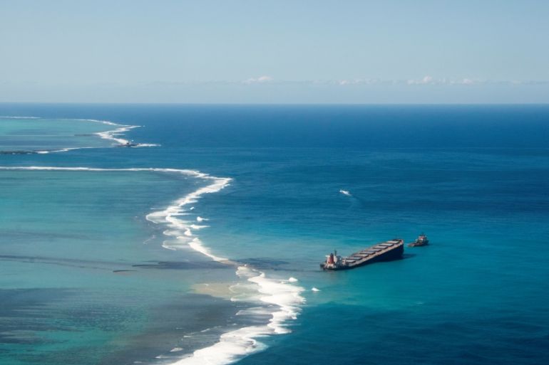A general view shows the bulk carrier ship MV Wakashio, that ran aground on a reef, at Riviere des Creoles