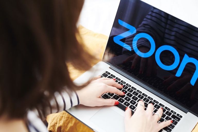 The logo for the Zoom Video Communications Inc application is displayed on an Apple Inc laptop computer in an arranged photograph taken in New York City, the US.
