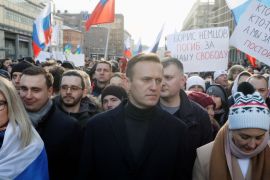 Russian opposition leader Alexey Navalny and his wife Yulia take part in a rally to mark the 5th anniversary of Boris Nemtsov's murder in Moscow on February 29, 2020 [File: Reuters/Shamil Zhumatov]