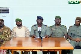 Speaking on national broadcaster ORTM TV, Colonel-Major Ismael Wague, centre, spokesman for the soldiers identifying themselves as National Committee for the Salvation of the People, announce that the