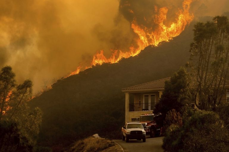 In this Monday, Aug. 17, 2020 file photo, flames from the River Fire crest a ridge in Salinas, Calif.