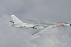 China H-6 bomber flying in the clouds over the East China Sea.