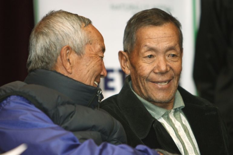 Ang Rita Sherpa (R), who climbed Mount Everest 10 times without the use of supplemental oxygen, talks to Min Bahadur Sherchan, the oldest person to scale Mount Everest, at a news conference in Kathman