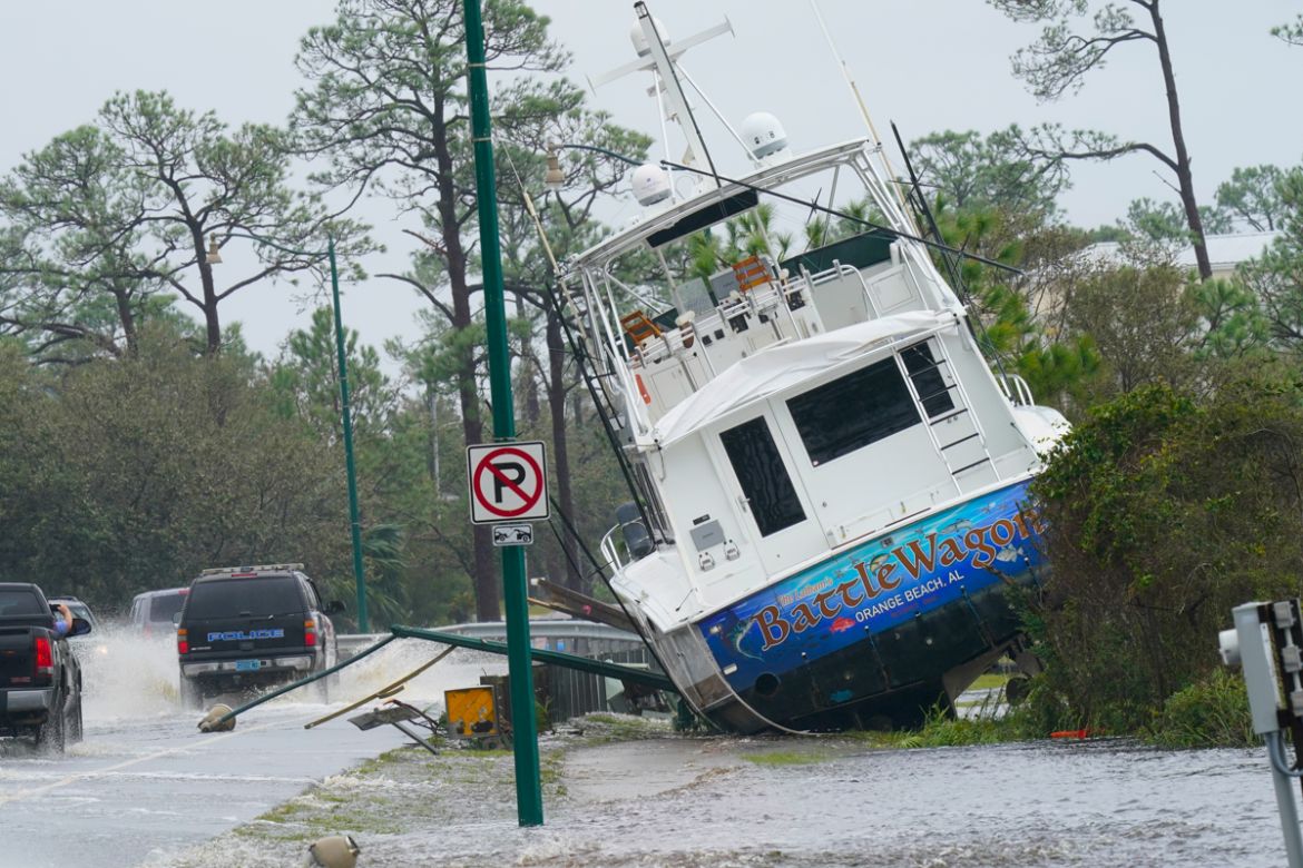 A boat is washed up near a road after Hurricane Sally moved through the area, Wednesday, Sept. 16, 2020, in Orange Beach, Ala. Hurricane Sally made landfall Wednesday near Gulf Shores, Alabama, as a C