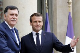 French President Emmanuel Macron meets Libyan Prime Minister Fayez al-Sarraj, who heads the UN-recognised government in Tripoli at the Elysee Palace in Paris on May 8, 2019 [File: Reuters/Philippe Wojazer]