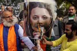 Activists from United Hindu Front burn an effigy depicting climate change activist Greta Thunberg to protest against her comments in support of protesting farmers, in New Delhi on February 4, 2021 [Reuters/Danish Siddiqui]