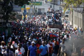 Demonstrators take part in a march during a protest against Haiti&#39;s then-President Jovenel Moïse, in Port-au-Prince, Haiti, February 14, 2021 [File: Jeanty Junior Augustin/Reuters]