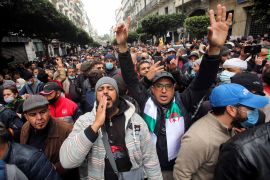 Demonstrators shout slogans as they march to mark the second anniversary of a mass protest movement demanding political change in Algiers on February 22, 2021 [Reuters/Ramzi Boudina]