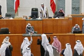 Kuwaiti MPs speak with parliament speaker Marzouq al-Ghanim