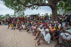 People displaced by the violence in Cabo Delgado gather for a community meeting in the Tara Tara district of Matuge, northern Mozambique on February 24, 2021 [AFP/Alfredo Zuniga]