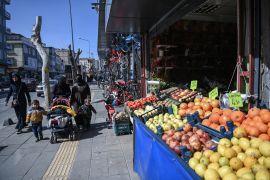 Syrian families shop on Inonu street in the southeastern Turkish province of Gaziantep [File: Ozan Kose/AFP]