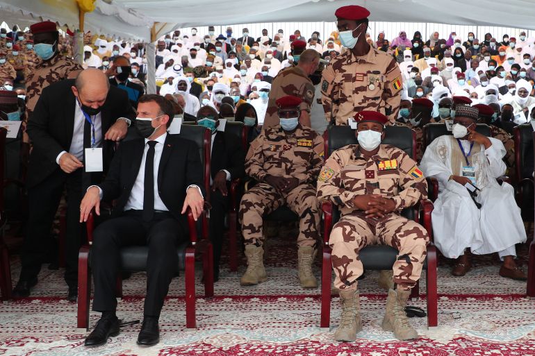 French President Emmanuel Macron sits in the front row next to Mahamat Idriss Deby, head of Chad's transitional military council