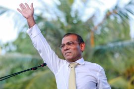Former president of the Maldives Mohamed Nasheed waves.