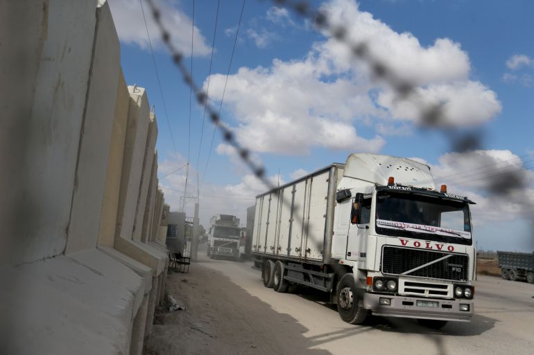 Palestinian trucks are seen leaving the main commercial crossing with Gaza, Kerem Shalom, in the southern Gaza strip August 11, 2020. REUTERS/Ibraheem Abu Mustafa