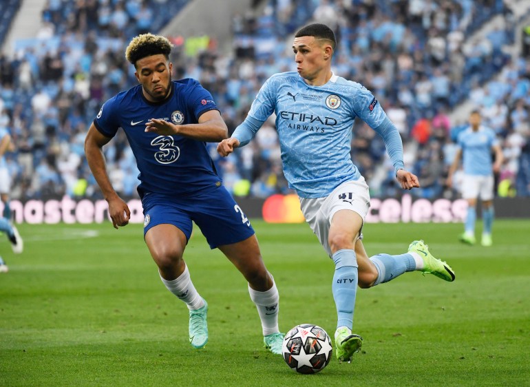 Soccer Football - Champions League Final - Manchester City v Chelsea - Estadio do Dragao, Porto, Portugal - May 29, 2021 Manchester City's Phil Foden in action with Chelsea's Antonio Rudiger Pool via REUTERS/Pierre-Philippe Marcou