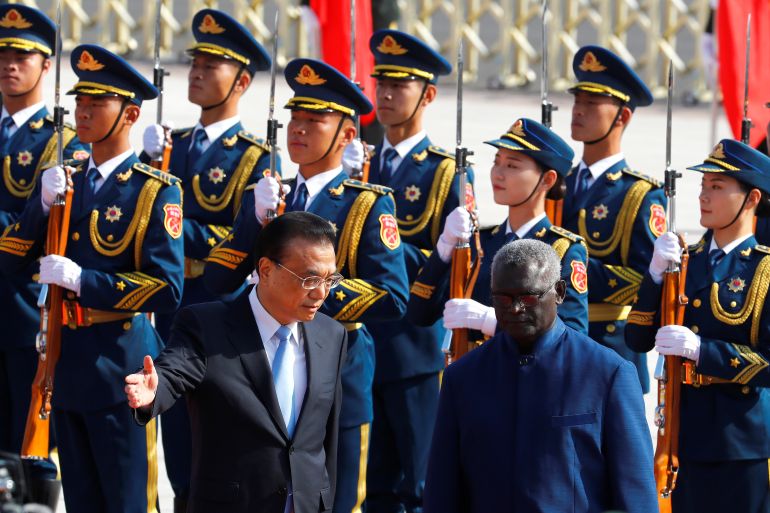 Solomon Islands Prime Minister Manasseh Sogavare attends a welcome ceremony with Chinese Premier Li Keqiang outside the Great Hall of the People in Beijing, China October 9, 2019 [Thomas Peter/Reuters]