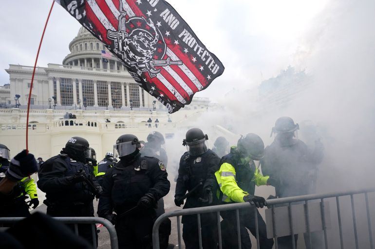 Capitol Police officers hold off rioters