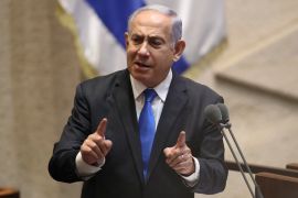 Israeli PM Benjamin Netanyahu speaks at a podium