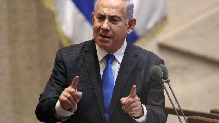 Israeli PM Benjamin Netanyahu speaks at a podium