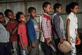 Children, who fled the violence in Ethiopia&#39;s Tigray region, wait in line for breakfast organised by a volunteer, in Mekelle, the capital of Tigray region, on June 23, 2021 [File: Yasuyoshi Chiba/AFP]