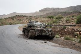 A tank allegedly from the Eritrean army is abandoned along the road in Dansa, southwest of Mekele in Tigray region, Ethiopia, on June 20, 2021. (Photo by Yasuyoshi CHIBA / AFP)