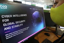 A woman checks the website of Israel-made Pegasus spyware at an office in the Cypriot capital Nicosia on July 21, 2021 [Mario Goldman/AFP]