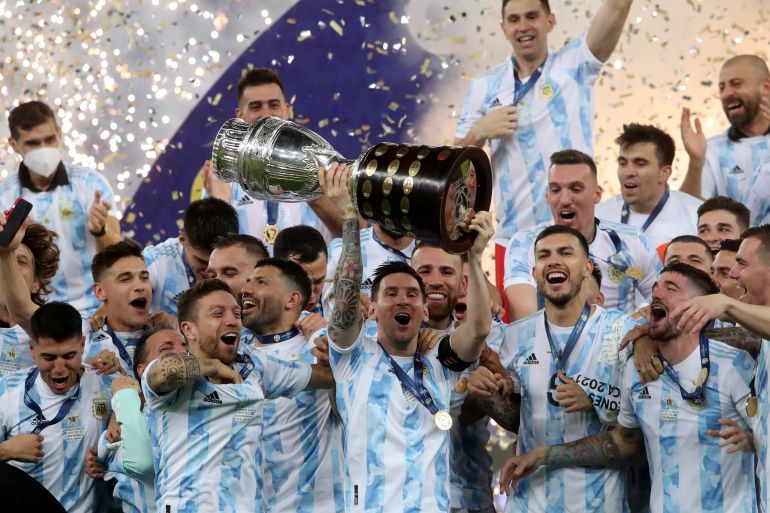 Argentina's Lionel Messi and teammates celebrate winning the Copa America with the trophy