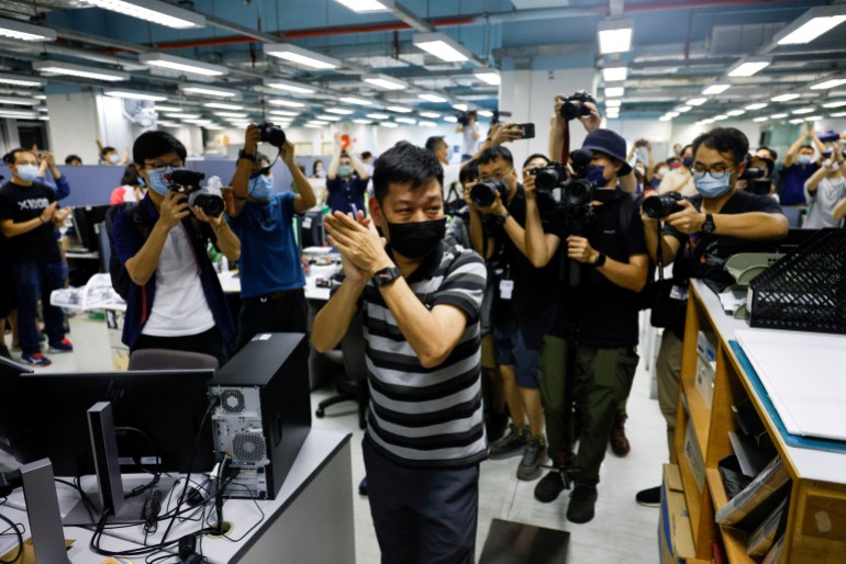 FILE PHOTO: Lam Man-chung, Executive Editor-in-Chief of Apple Daily reacts on the day of the newspaper's final edition in Hong Kong, China June 23, 2021. REUTERS/Tyrone Siu/File Photo