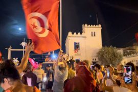 Crowds gather on the street after Tunisia&#39;s president suspended Parliament, in La Marsa, near Tunis, Tunisia, July 26, 2021, in this still image obtained from a social media video. [Layli Foroudi/Reuters]