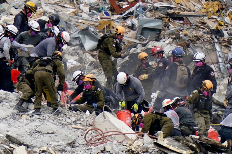 Crews from the United States and Israel work in the rubble of the Champlain Towers South condo