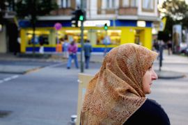 A Muslim woman waits to cross a street in Berlin&#39;s Neukoelln district. [File: Sean Gallup/Getty Images]
