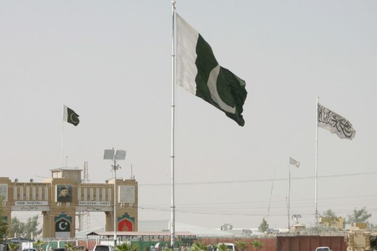 General view of Pakistan and Taliban flags.