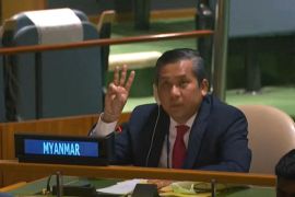 Diplomat Moe Kyaw Tun making the three fingered salute of Myanmar's anti-coup movement at a UN meeting five days after the military seized power. He is sitting at the Myanmar desk in the UN General Assembly