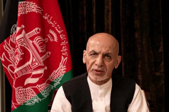 Former Afghan President Ashraf Ghani poses for the camera