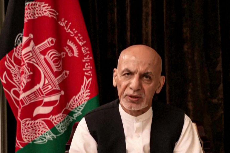 Former Afghan President Ashraf Ghani poses for the camera