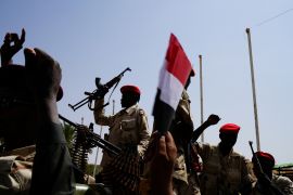 Sudan's paramilitary Rapid Support Forces (RSF) soldiers greet people as they secure a site where Lieutenant General Mohamed Hamdan Dagalo, deputy head of the military council and head of RSF, attends a meeting in Khartoum, Sudan, June 18, 2019. REUTERS/Umit Bektas
