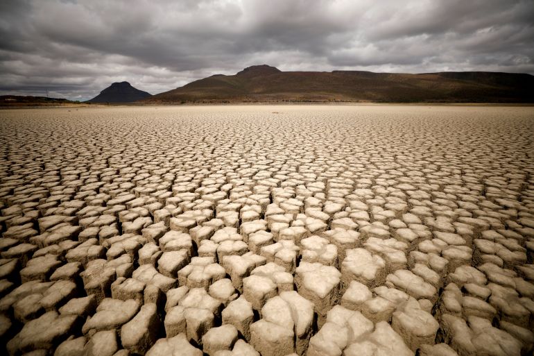 The dried up municipal dam in drought-stricken Graaff-Reinet, South Africa, in 2019 [File: Mike Hutchings/Reuters]