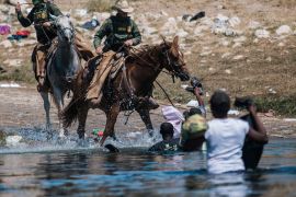 US Customs and Border Protection mounted officers try to push back asylum seekers, as they cross the Rio Grande from Ciudad Acuña, Mexico, into Del Rio, Texas on September 19, 2021 [AP/Felix Marquez]