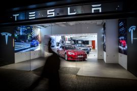 Electric automobiles are displayed inside a Tesla Inc. store in Barcelona in 2019.