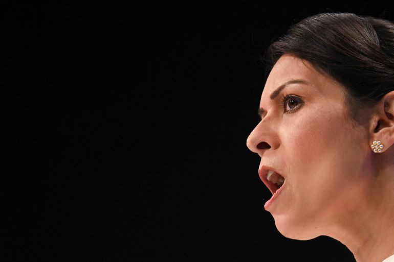 UK Home Secretary Priti Patel speaking at a Conservative party conference in Manchester