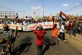 Protesters march against the Sudanese military&#39;s recent seizure of power and ousting of the civilian government, in the streets of the capital Khartoum on October 30, 2021 [Reuters/Mohamed Nureldin]