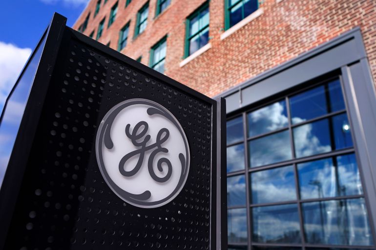 The General Electric logo is displayed on a sign outside their Boston headquarters.