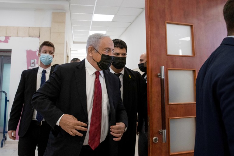 Former Israeli Prime Minister Benjamin Netanyahu, arrives to hear testimony by star witness Nir Hefetz, a former aide, in his corruption trial at the District Court in east Jerusalem, Monday, Nov. 22, 2021